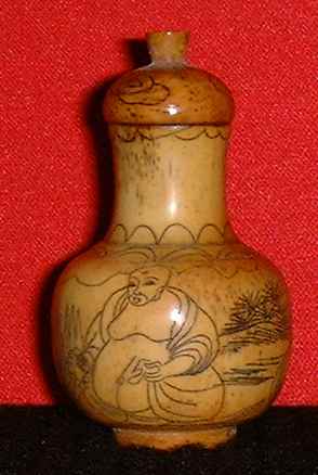 Carving on animal bone (Back view)